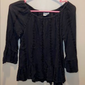 Black blouse with mid length sleeves.